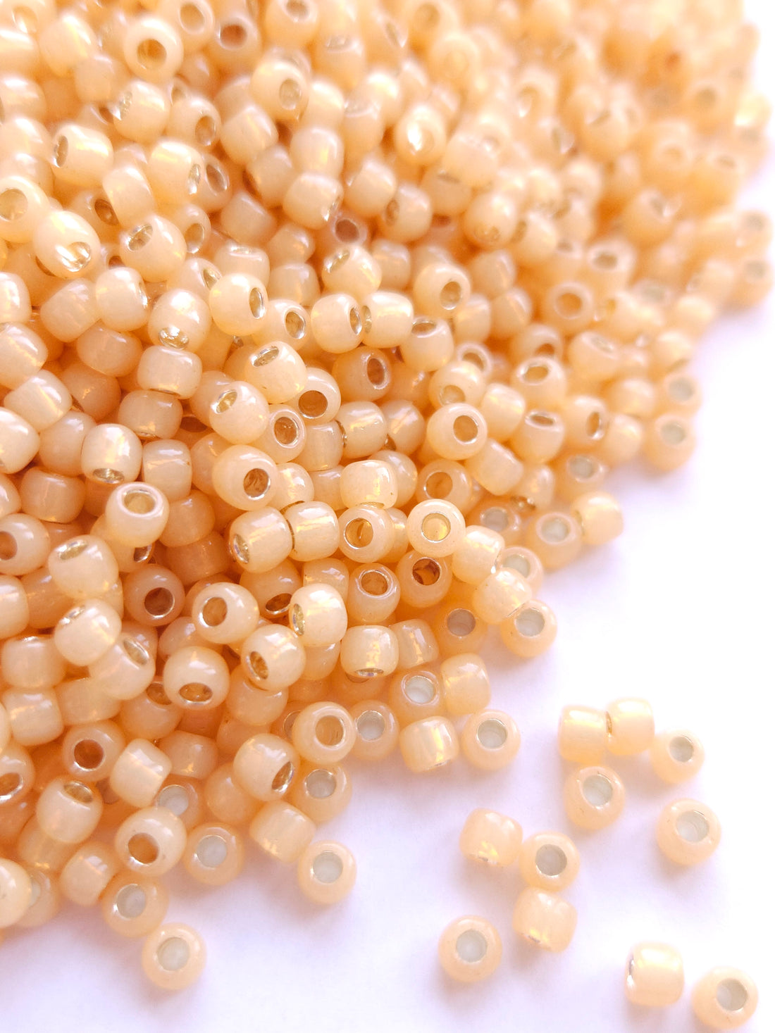 TOHO Seed Beads 6/0 Silver Lined Milky Lt Topaz TR-6-2110