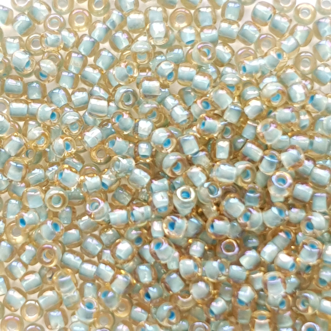 TR-11-952 : TOHO - Round 11/0 : Inside-Color Rainbow Lt Topaz/Sea Foam-Lined