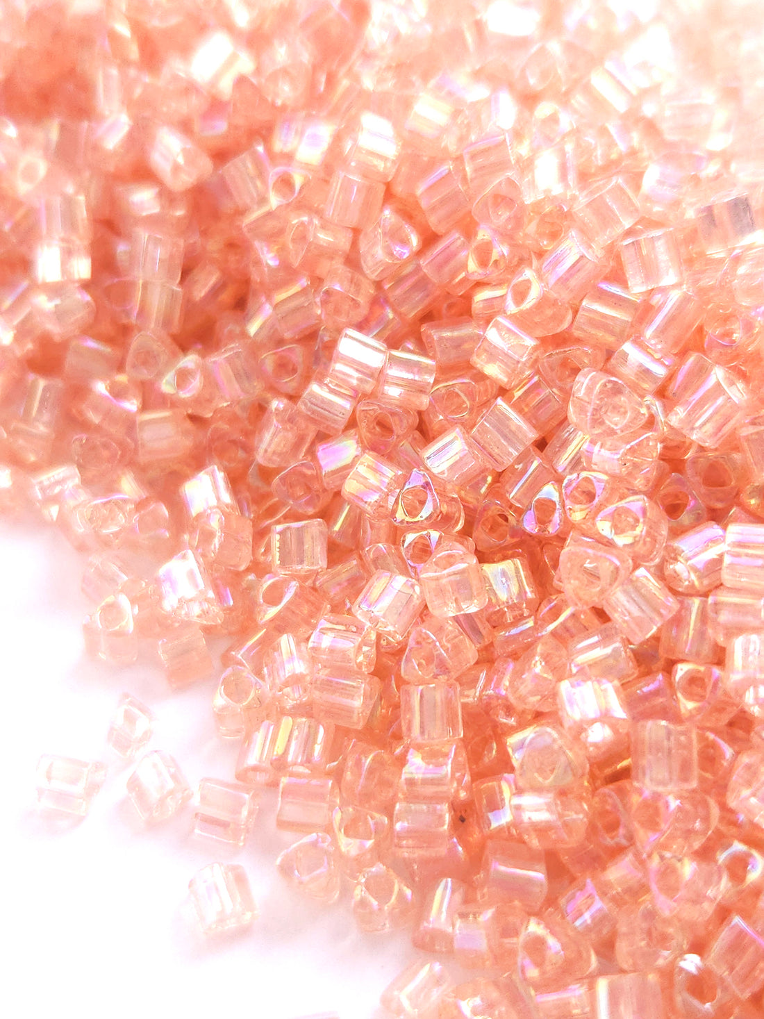 TOHO 8/0 Triangle Beads Transparent Rainbow Rosaline