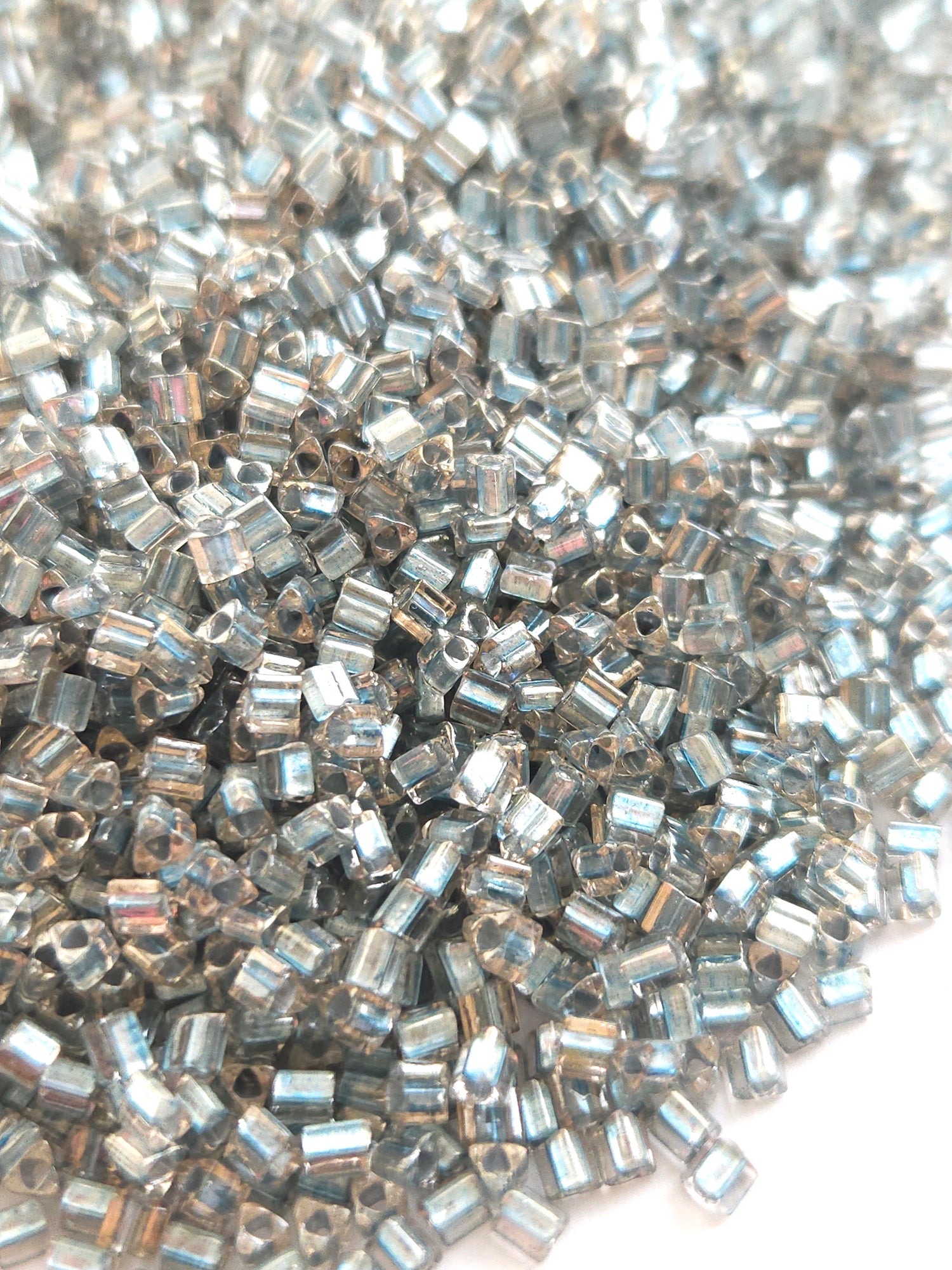 TOHO 8/0 Triangle Beads Inside Color Crystal Metallic Blue Lined