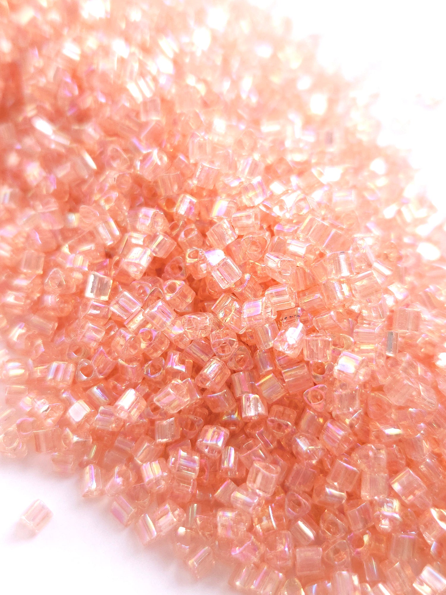 TOHO 8/0 Triangle Beads Transparent Rainbow Rosaline